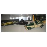 (3) Trucks & Display Case  largest 8 inches