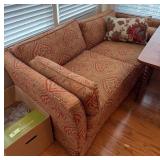 Upholstered Loveseat with Decorative Pattern