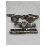 Three Wristwatches and Spare Bracelet