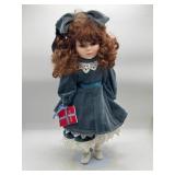 Porcelain Doll in Blue Velvet Dress