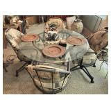 Glass-Top Table With Four Metal Chairs