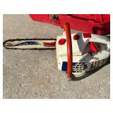 Vintage Chainsaw With Red Carry Case