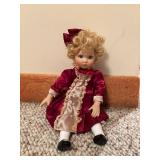 Porcelain Doll in Red Satin Dress