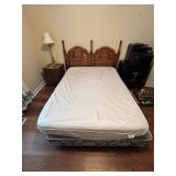 Full-Size Bed With Wooden Headboard