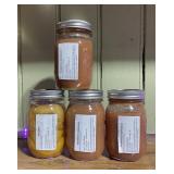 4 jars of homemade strawberry applesauce and