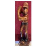 Hand-carved wooden figurine of a Golfer