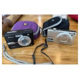Two Digital Cameras with Accessories