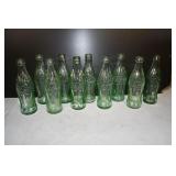 Lot of 10 Vtg Green Coca Cola Embossed Bottles