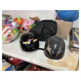 Two Motorcycle Helmets With Graphics