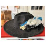 Black Hat with Feather and Floral Decoration