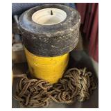 Yellow Metal Can with Tire and Rope
