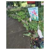 Decorative Outdoor Items in Flower Bed