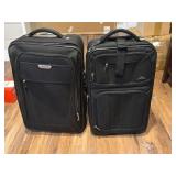 Two Black Wheeled Luggage Bags