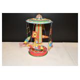 Tin Ride A Rocket Wind Up Toy