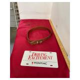 Leather Belt and Pontiac License Plate