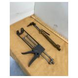 Torch and Caulk Gun