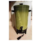 Green and Black Cylindrical Device with Electrical