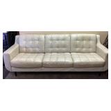 CHATEAU D AX IVORY COLORED PLEATHER SOFA IN GOOD