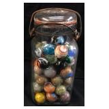 JAR OF VINTAGE GLASS SHOOTERS AND MARBLES