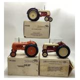 3) ERTL die cast tractors. Cockshutt series