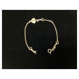 18k yellow gold charm bracelet heart locks and