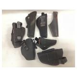 7 pistol holsters, semi auto and revolver