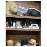 Wooden hat blocks, a green vintage hat with a
