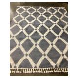 Moroccan-inspired trellis pattern and tasseled
