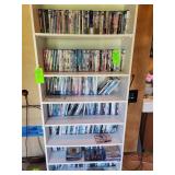 Seven shelves of assorted DVDs