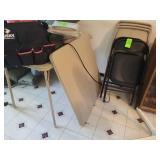Two folding tables six foxholding chairs