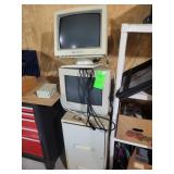 File cabinet and 4 monitors