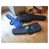 3 empty guitar cases