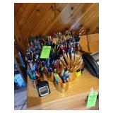 Pens, pencils, desk top contents