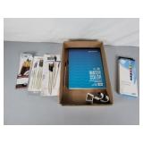 Paint brushes, water color paint, sketch book