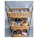 Basket & wrought iron shelving unit full of ribbon