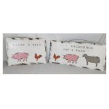 Two metal farm signs