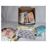 Large box of mostly upholstery fabric