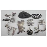 11 items Pins/Pendants 68.44 GRAMS