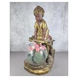 Plaster statue with fish bowl