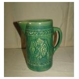 Greenish-blue milk/juice pitcher w grapevine