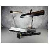 Three desk lamps. Two on stands, One clamp on