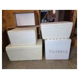 Five Styrofoam coolers with lids