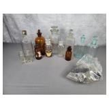 Large lot of apothecary jars with toppers