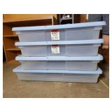 Four Rubbermaid containers with lids