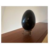 Polished stone on metal stand