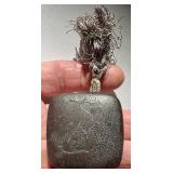 METAL NETSUKE with RAISED RELIEF FLORAL MOTIF