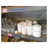 Assorted PVC Fittings on Shelf