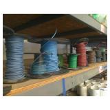 Assorted Spools of Wire on Shelf
