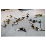 Tie pins and clasps