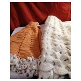Two crocheted capes, one child. One adult